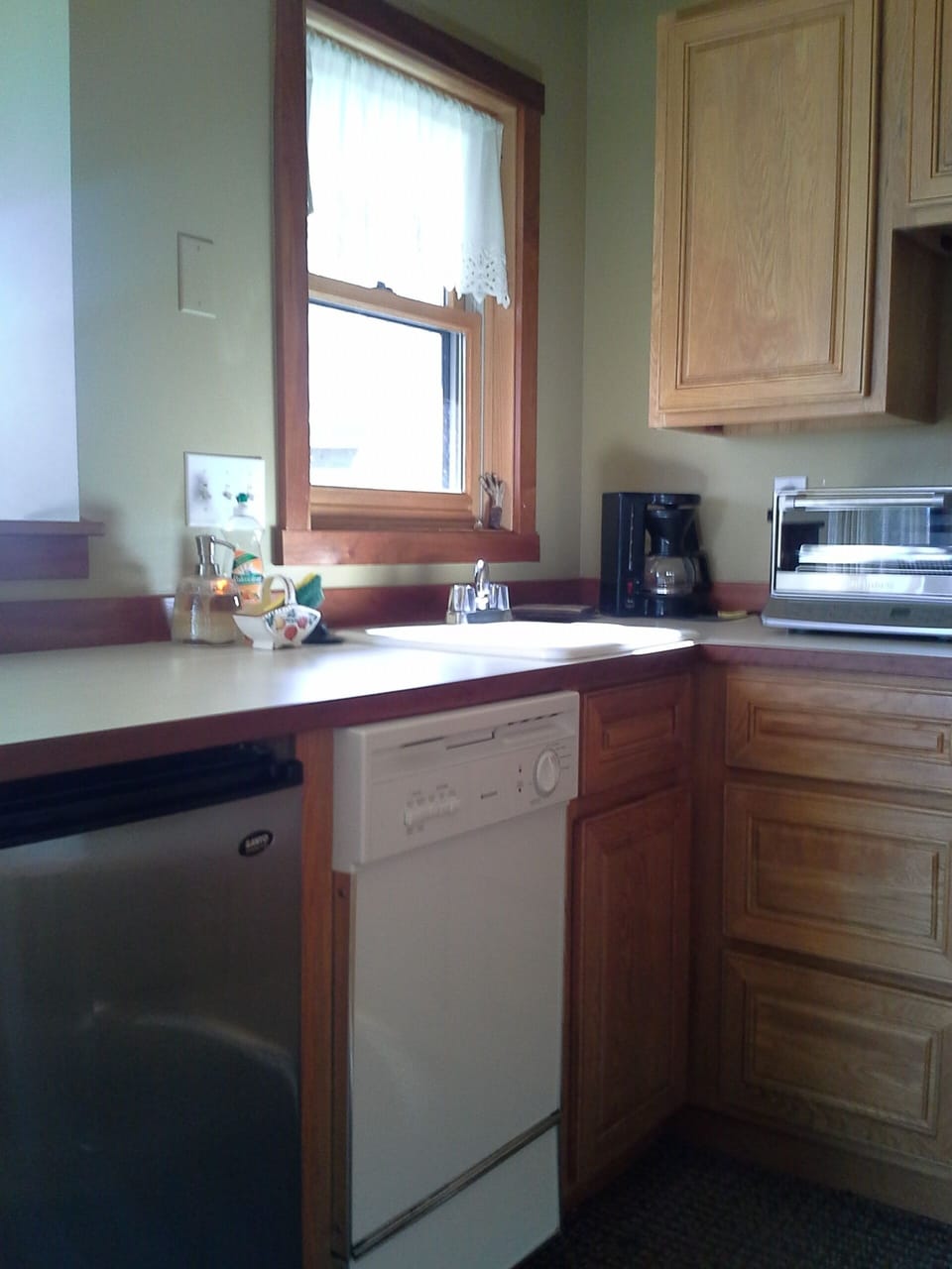 Kitchen with dishwasher, toaster oven, microwave and coffee maker