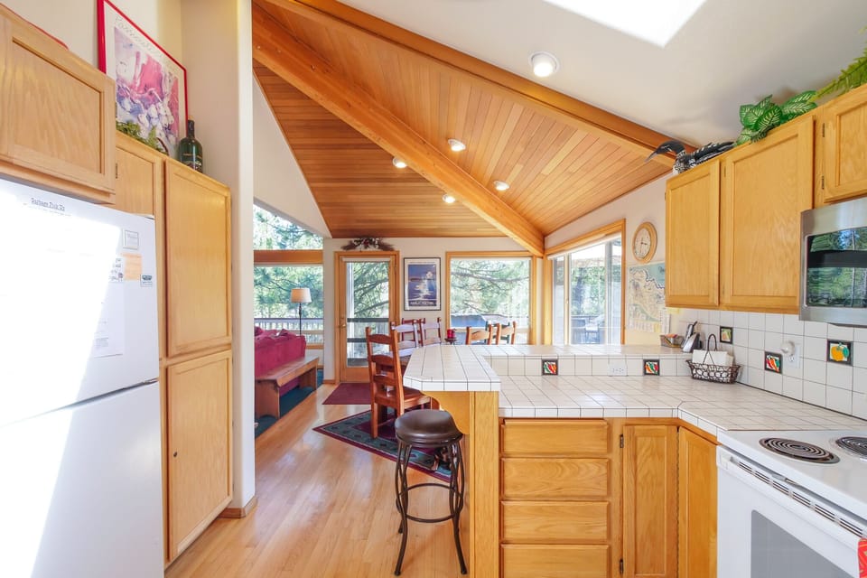 Kitchen looking into the dining area and eating bar,  