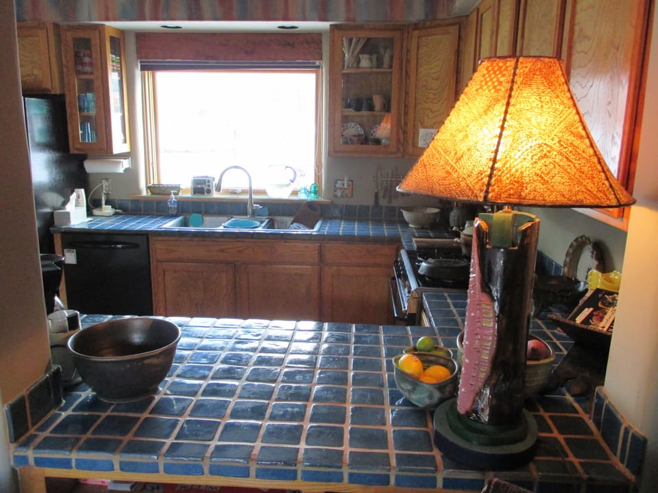 Kitchen looks out to Taos Mountain