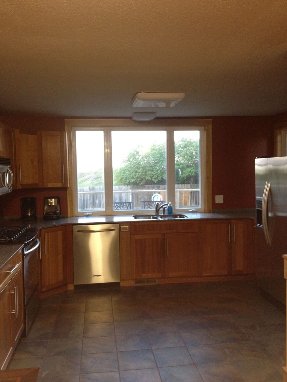 Kitchen with stainless steel Kitchen Aid appliances and silestone counter tops.