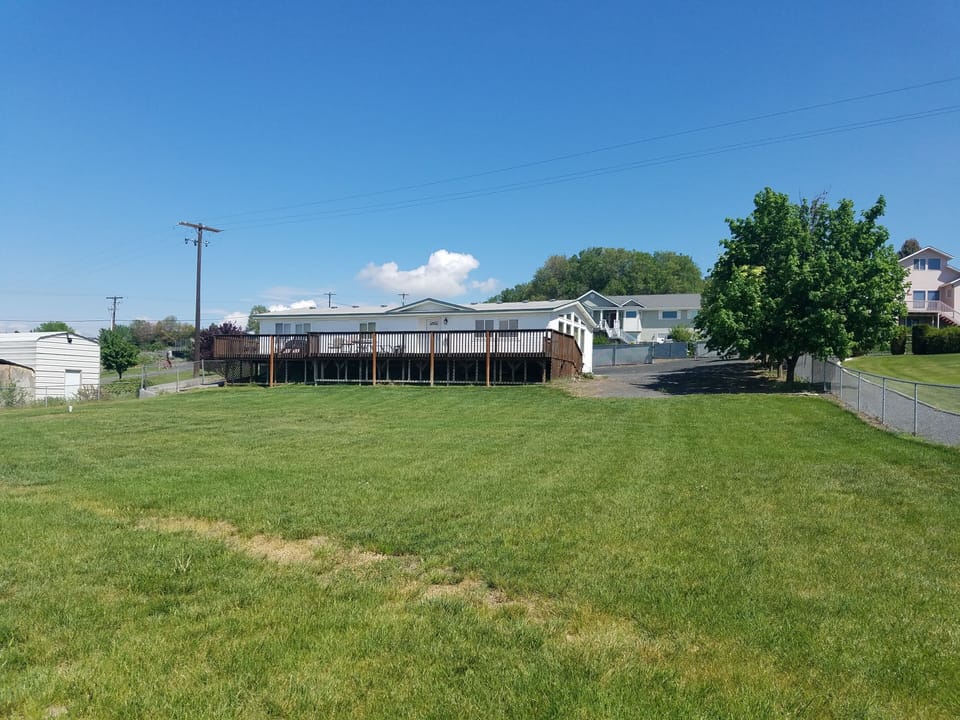 View of house from lake and dock area