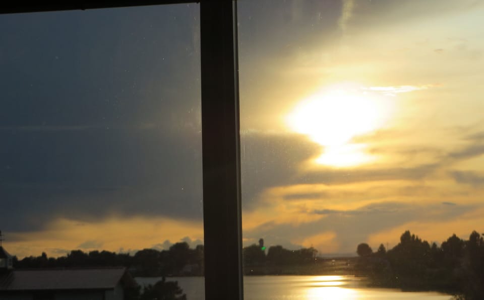 view of yard and lake from Bed room window.
