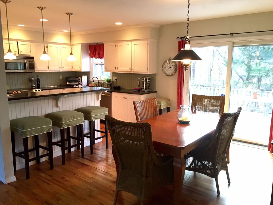 Dining room and kitchen. Back door leads to large deck and pool. Table extends.