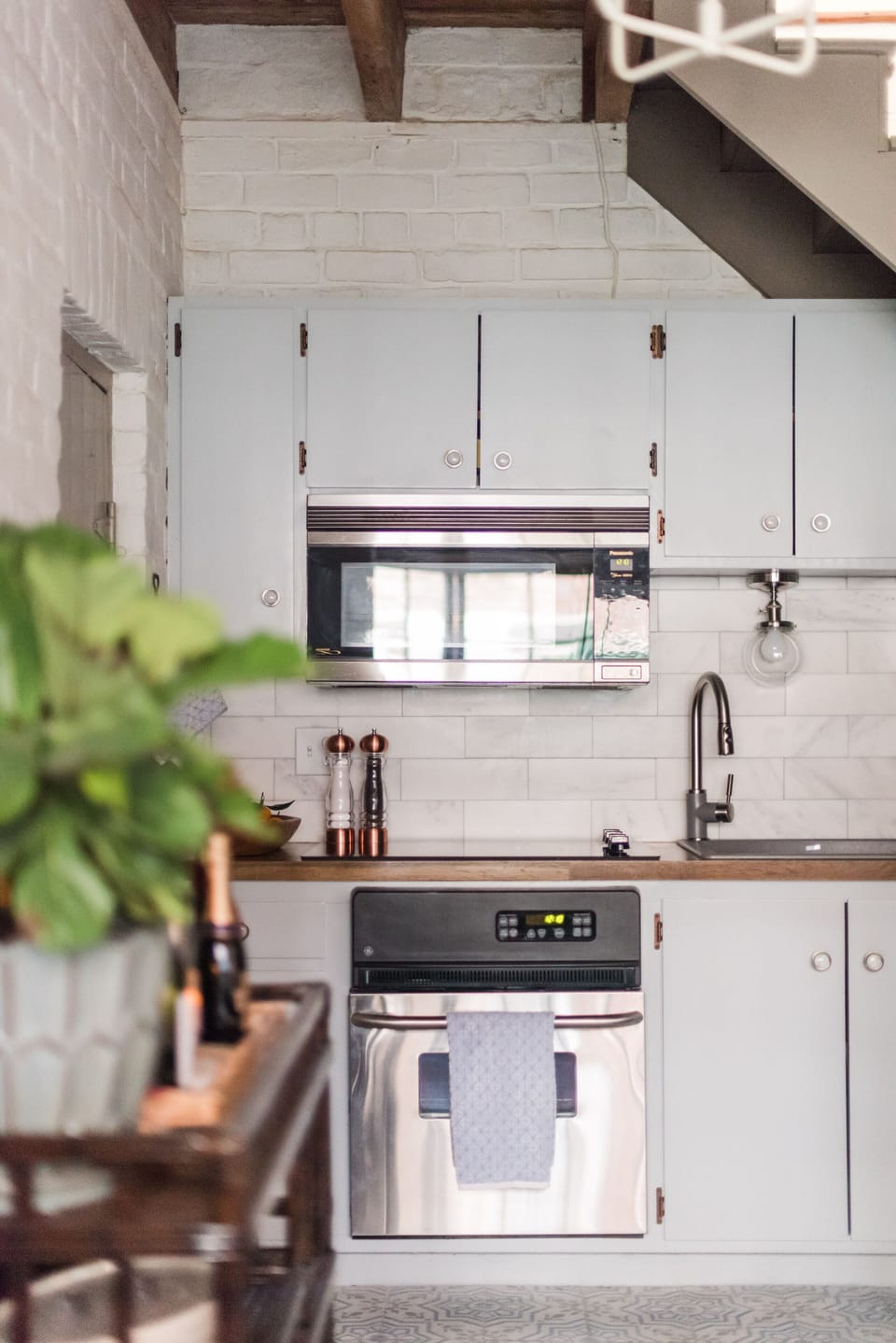 Modern appliances with charming furnishings tie this serene cottage together.