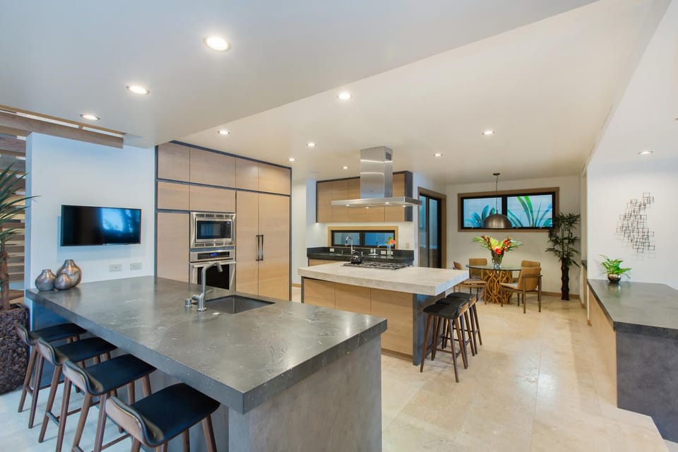 Open chef’s kitchen with sleek appliances and a spacious island for easy entertaining.