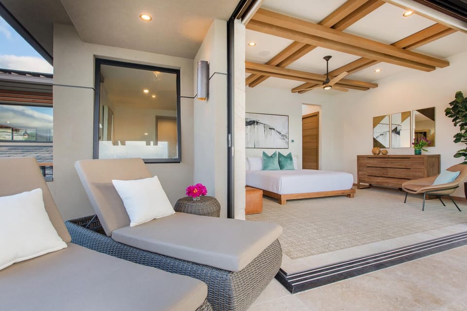 Second primary suite lanai with shaded seating, ideal for peaceful afternoons in the breeze.