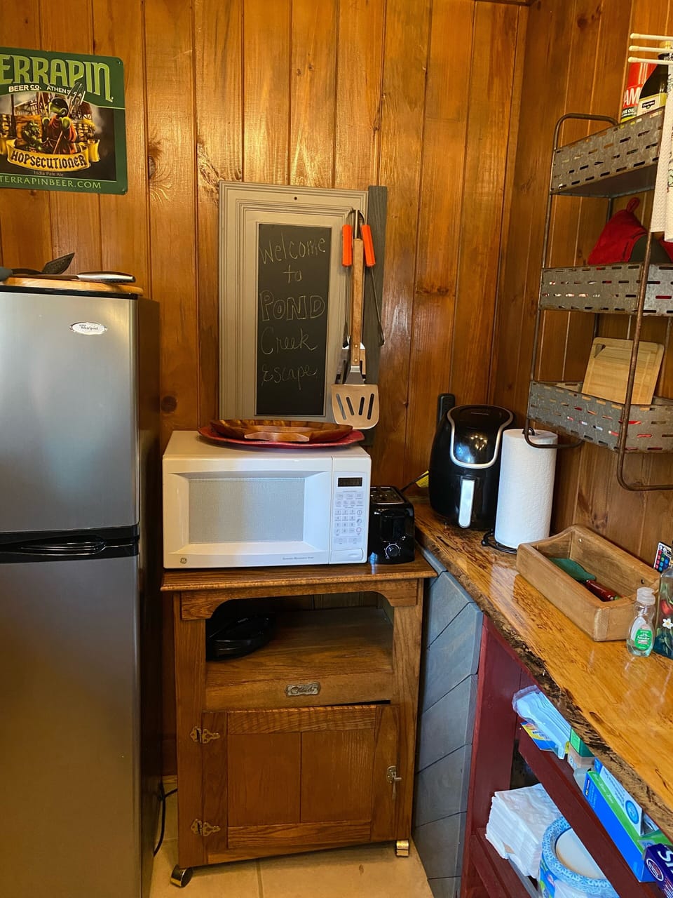 Refrigerator, microwave, toaster, and air fryer.