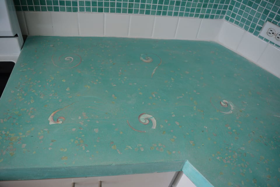 Closeup of new concrete countertops with inlaid conch shells