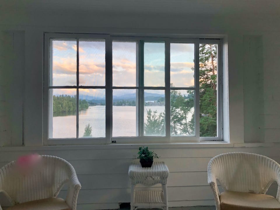 Second floor hideaway porch off the primary and guest bedrooms. Serene lake view
