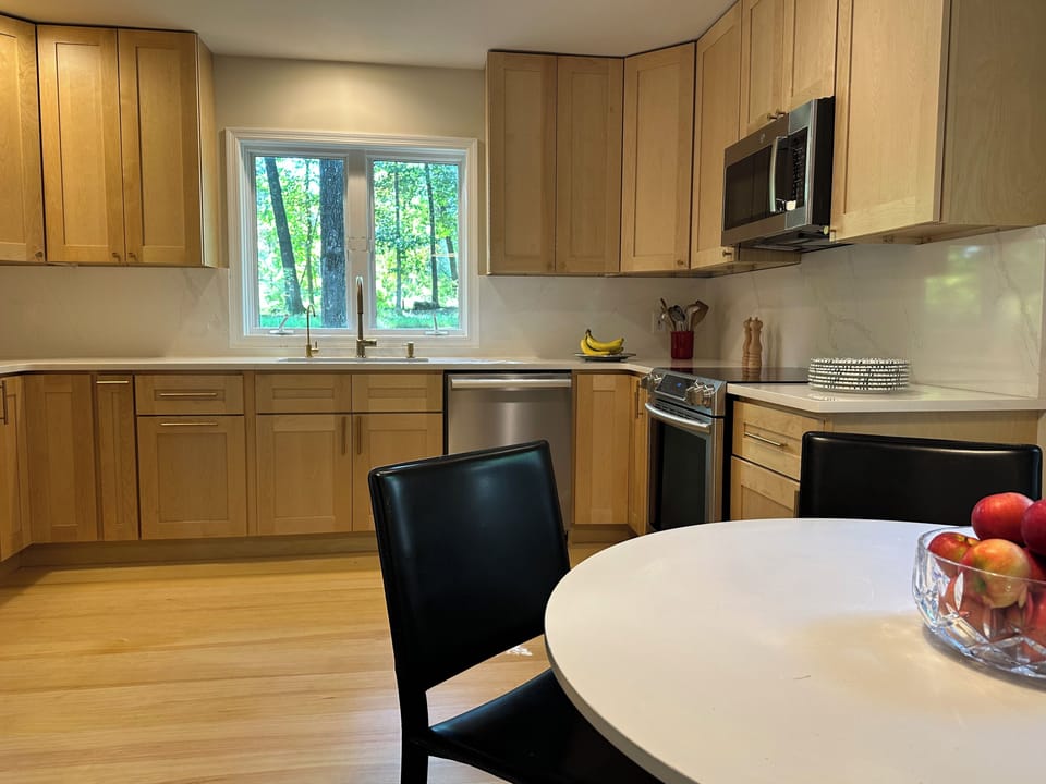 New kitchen with Miele dishwasher, induction range, and high end cookware