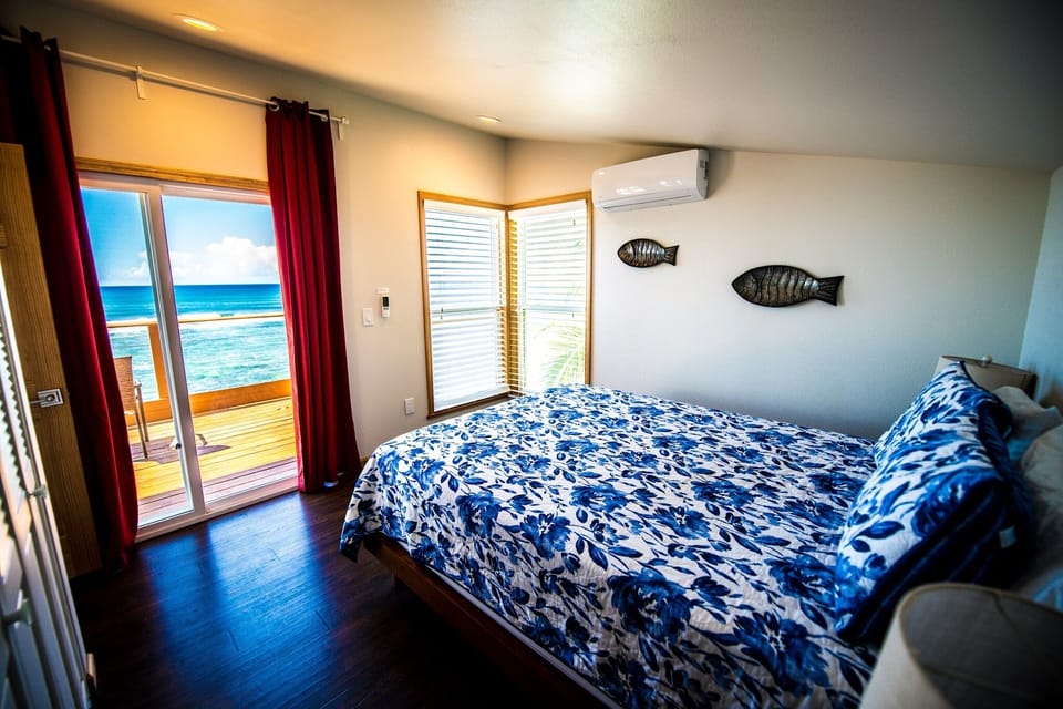 Upstairs queen bedroom, walks right out to the upstairs lanai