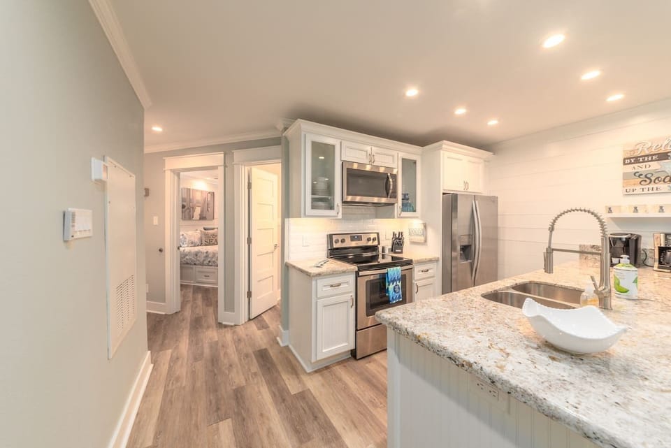 Master bedroom then bath next to the kitchen.