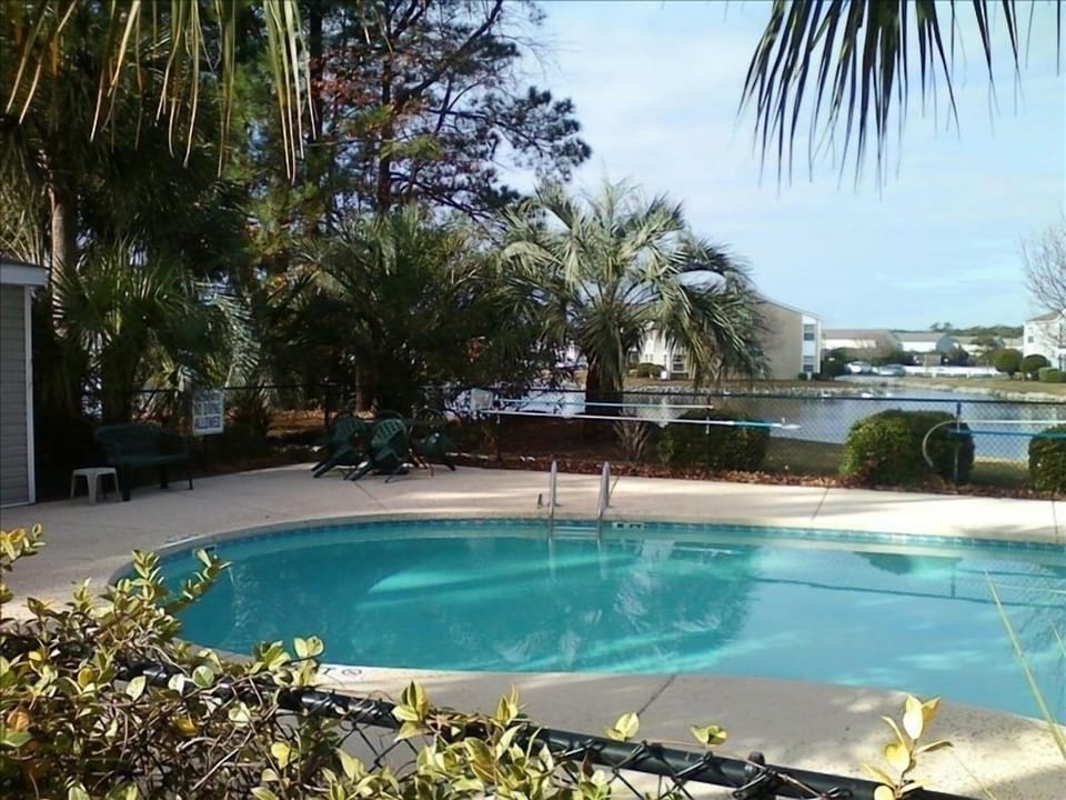 Tropical Pool w/ Lounge chairs, 
just feet away from our Ground Floor location