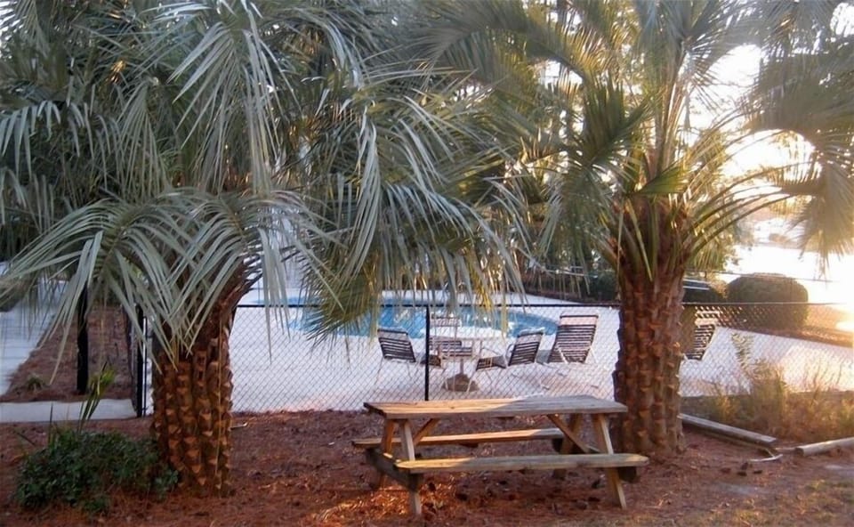 Poolside Picnic tables and Charcoal BBQ Grill