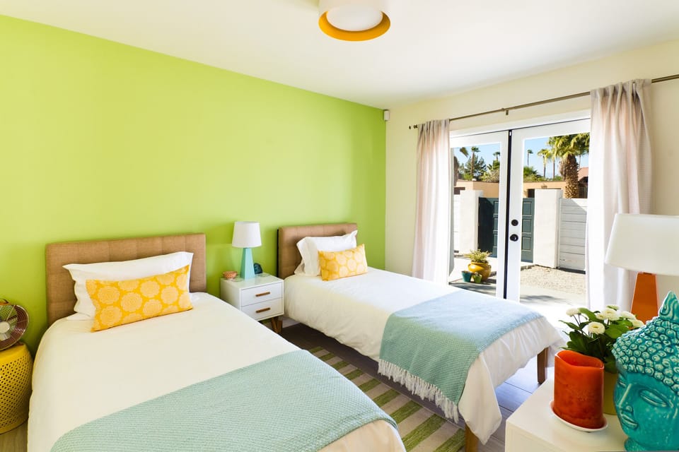 Third bedroom with twin beds and french doors