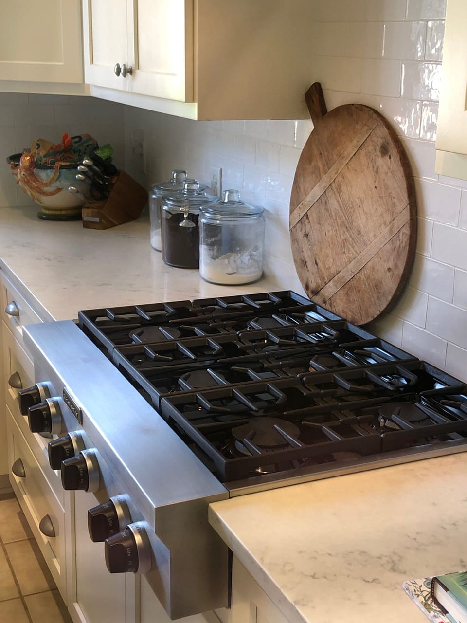 Renovated chef’s kitchen with gas cook top and oven. 