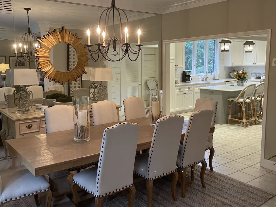 Dining room is open and adjacent to kitchen. Large table seats 8 adults.