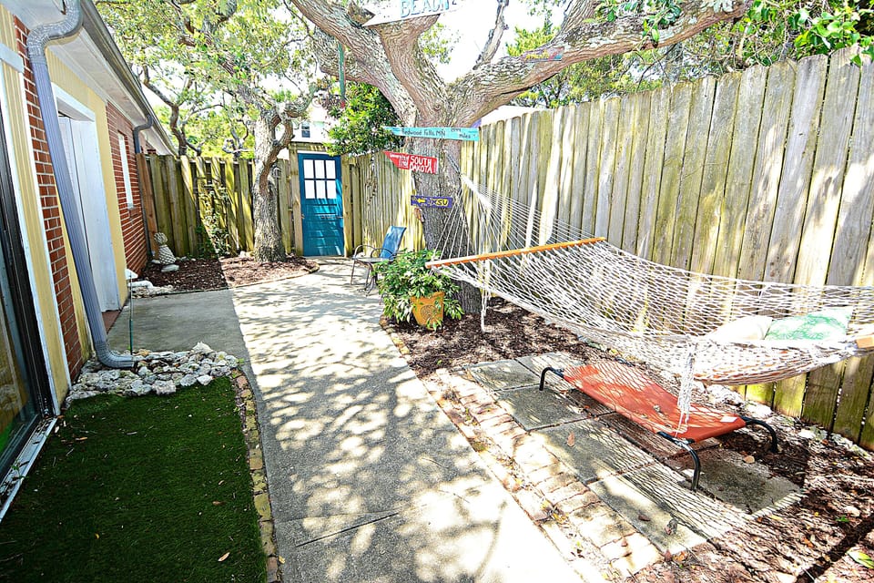 Private Outdoor area to main entrance to the bungalow.  Dog run area and hammock