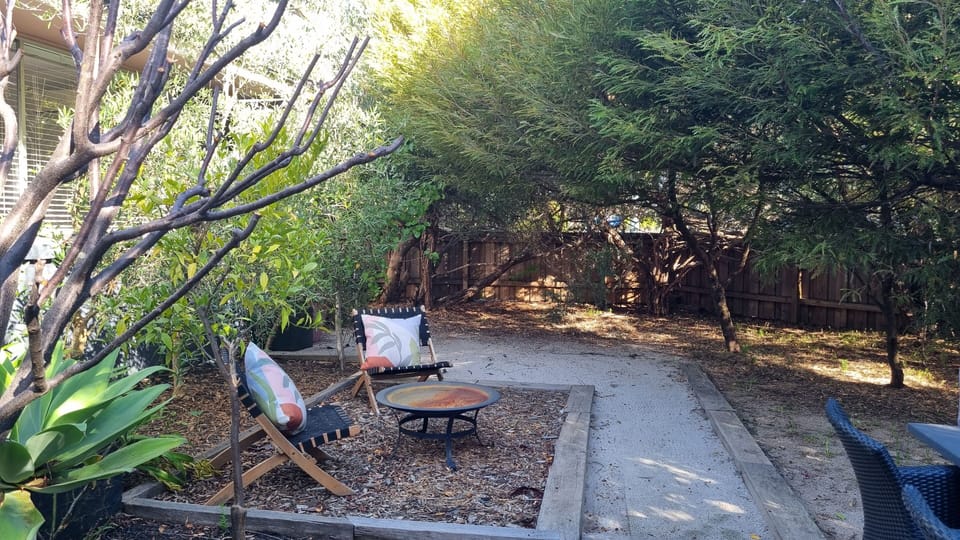 Toast marshmallows and sip shiraz  by the firepit in private front garden