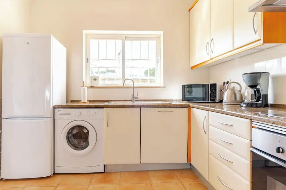 Well stocked kitchen with all appliances and dishes needed. 