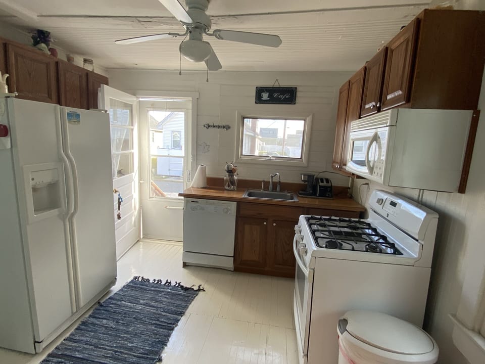 kitchen. gas stove, microwave, dishwasher, side by side refrigerator w ice maker