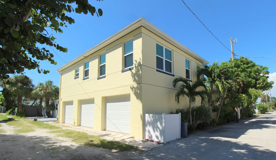 SE view of apartment atop the 3-car garage - one bay is reserved for you!