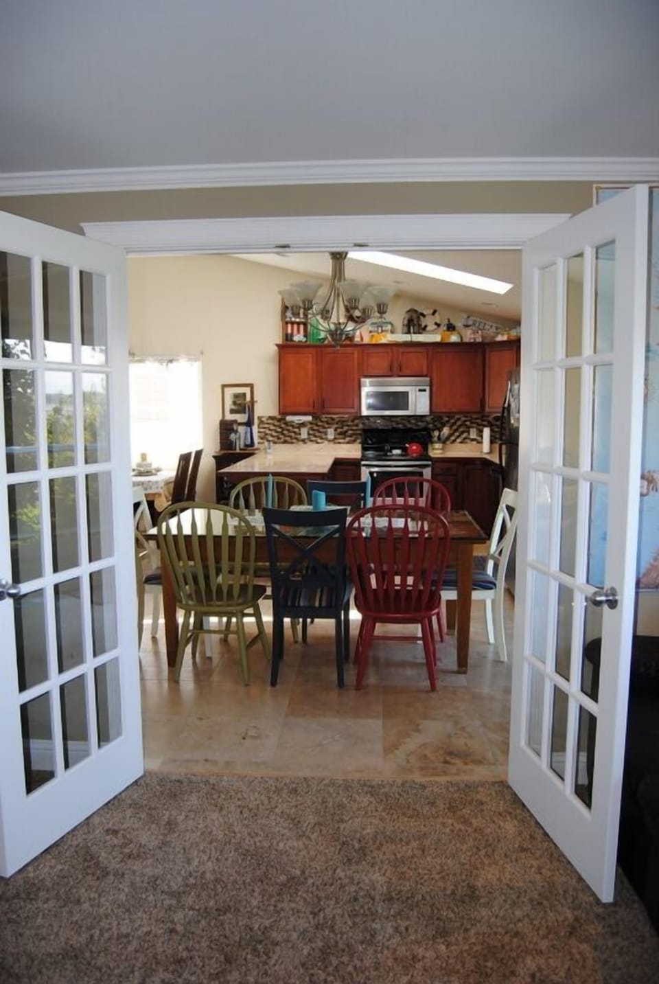 View from Den to the dining room and kitchen