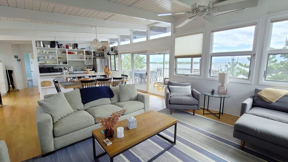 Living room opens to dining area and kitchen beyond