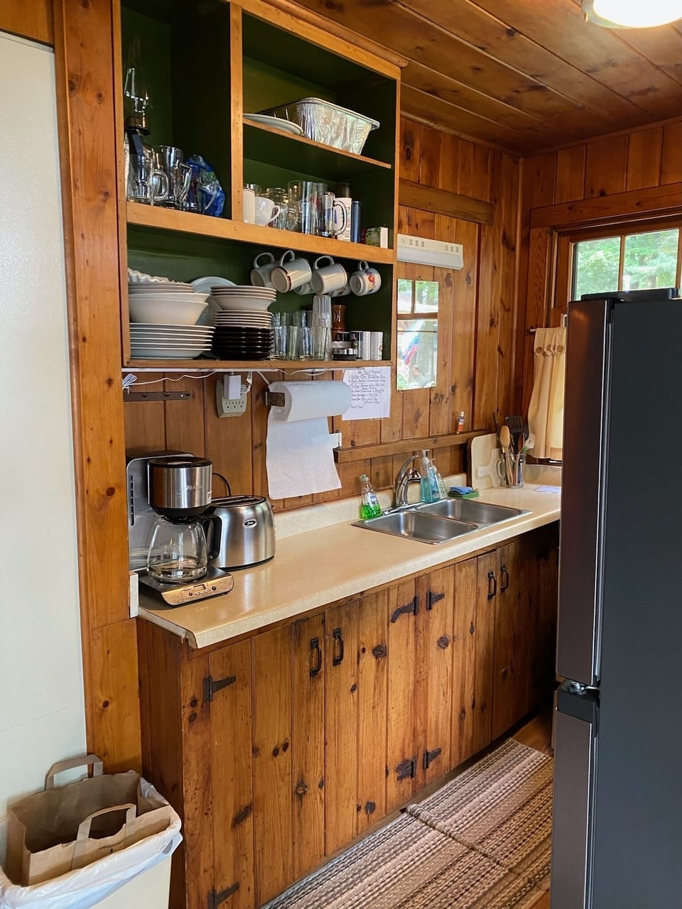 Full size sink, toaster drip coffee maker, dishes, pots, pans