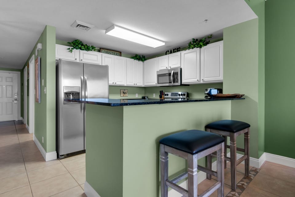 Kitchen - Elevate your stay with this fully equipped kitchen, featuring sleek appliances and all you need to create culinary masterpieces.