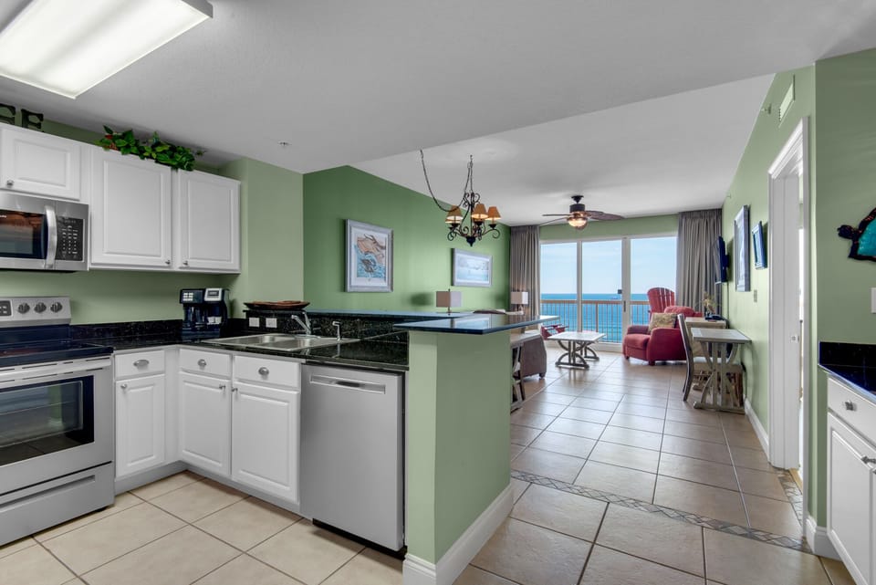 Kitchen - Elevate your stay with this fully equipped kitchen, featuring sleek appliances and all you need to create culinary masterpieces.