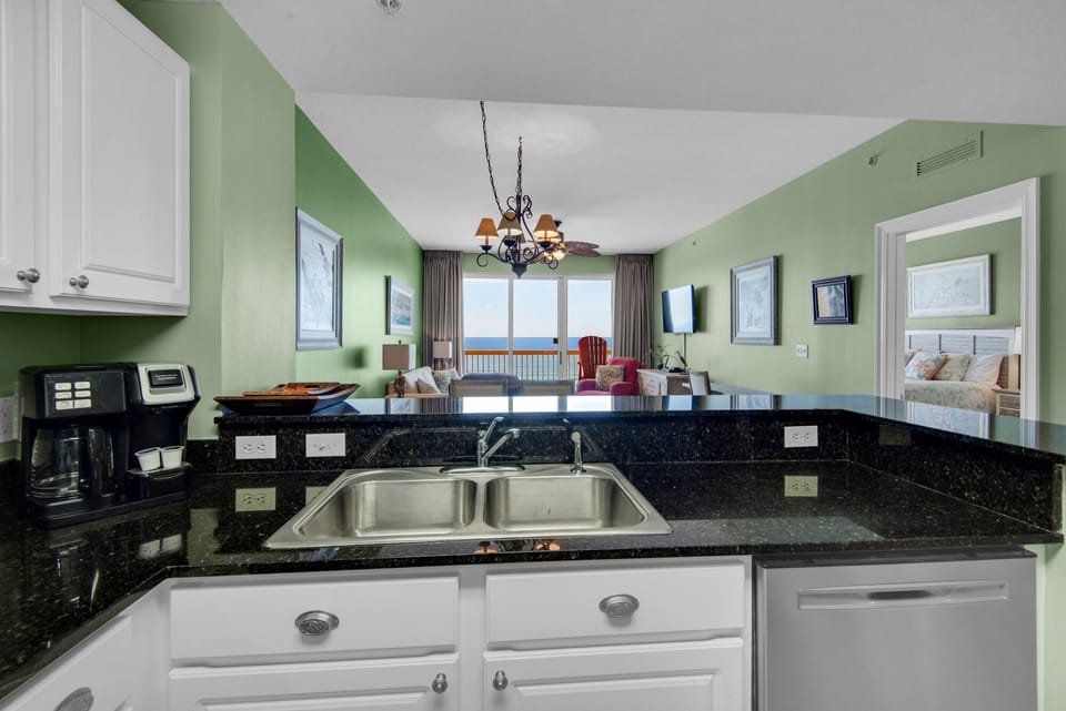 Kitchen - Elevate your stay with this fully equipped kitchen, featuring sleek appliances and all you need to create culinary masterpieces.