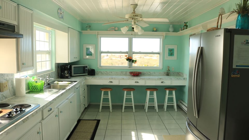 Kitchen bar looks over the Gulf of Mexico