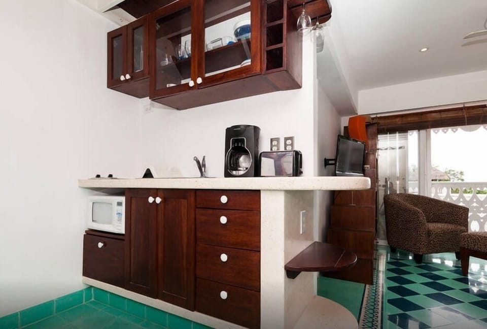 Efficient kitchen includes full size fridge not shown here
