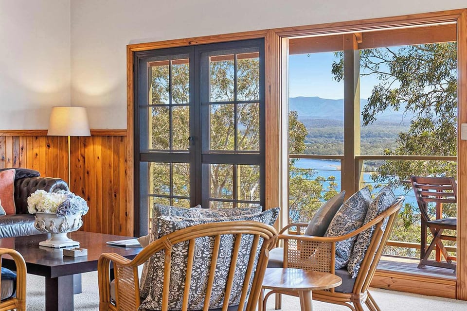 Open plan living area with lake views and fireplace!