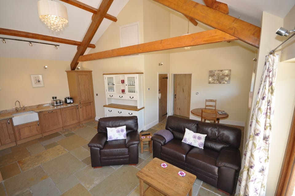 Living Room with leather sofas & french doors to outside and views