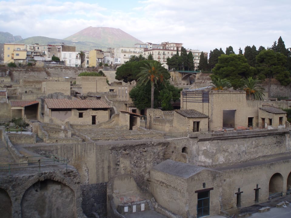 Herculaneum with Mount Vesuvius in the background and Pompeii to the right