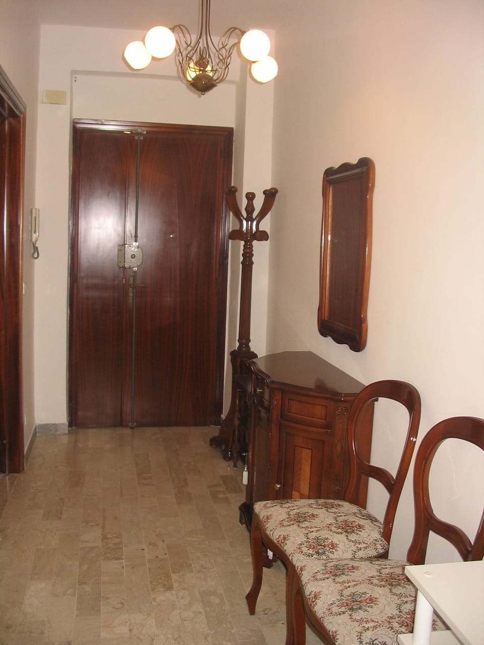 Entrance hall with coatstand and DVD and book cupboard