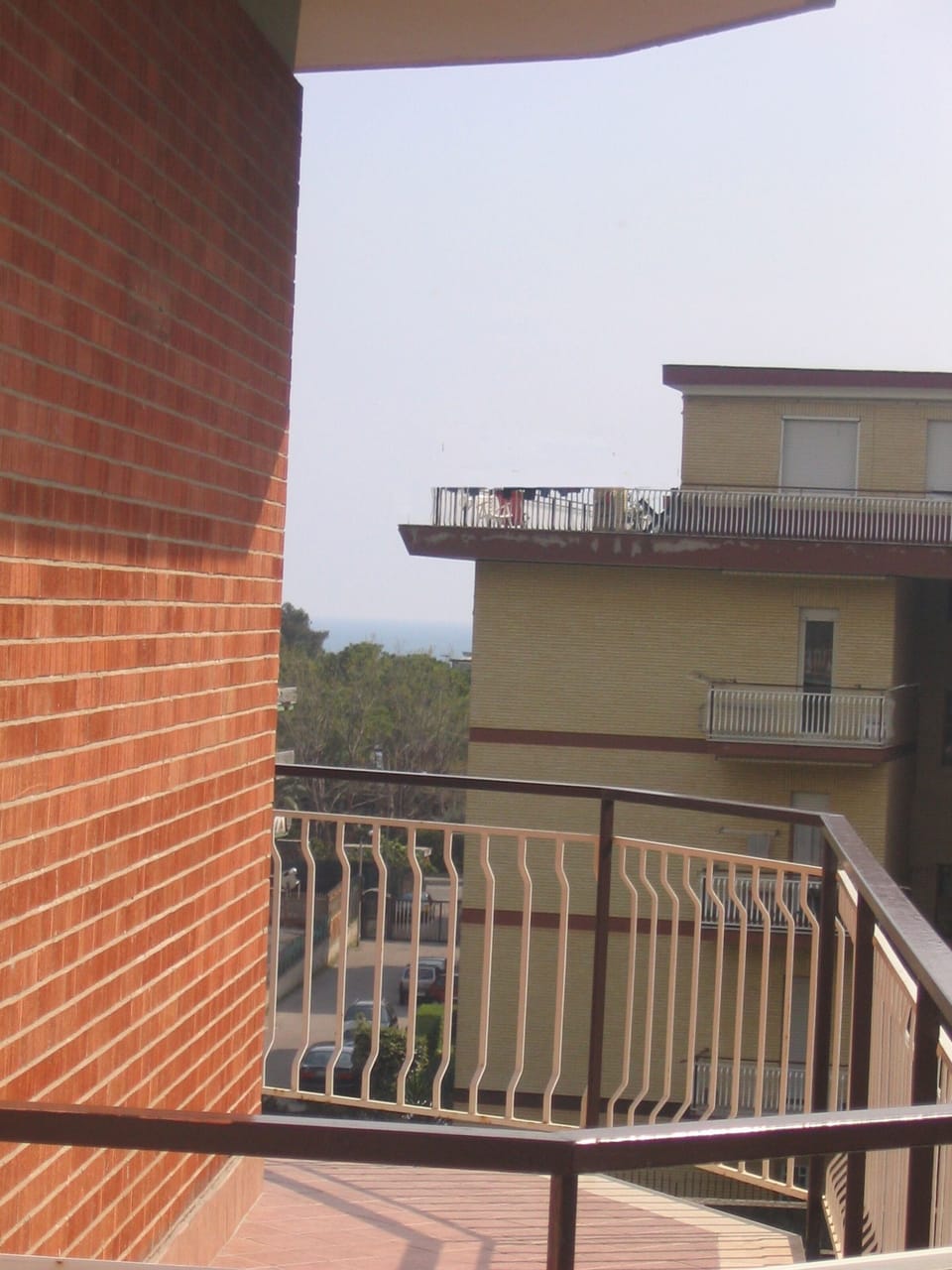 Balcony with sea view in the distance which shows how close we are from the sea