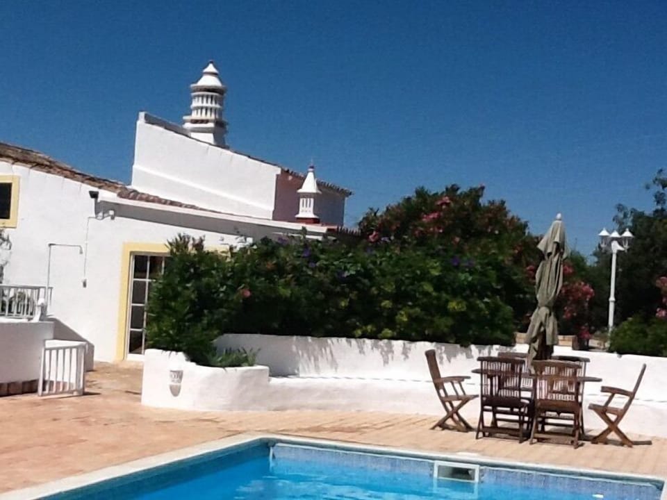 Largest chimney in the area,patio doors from garden room to pool.