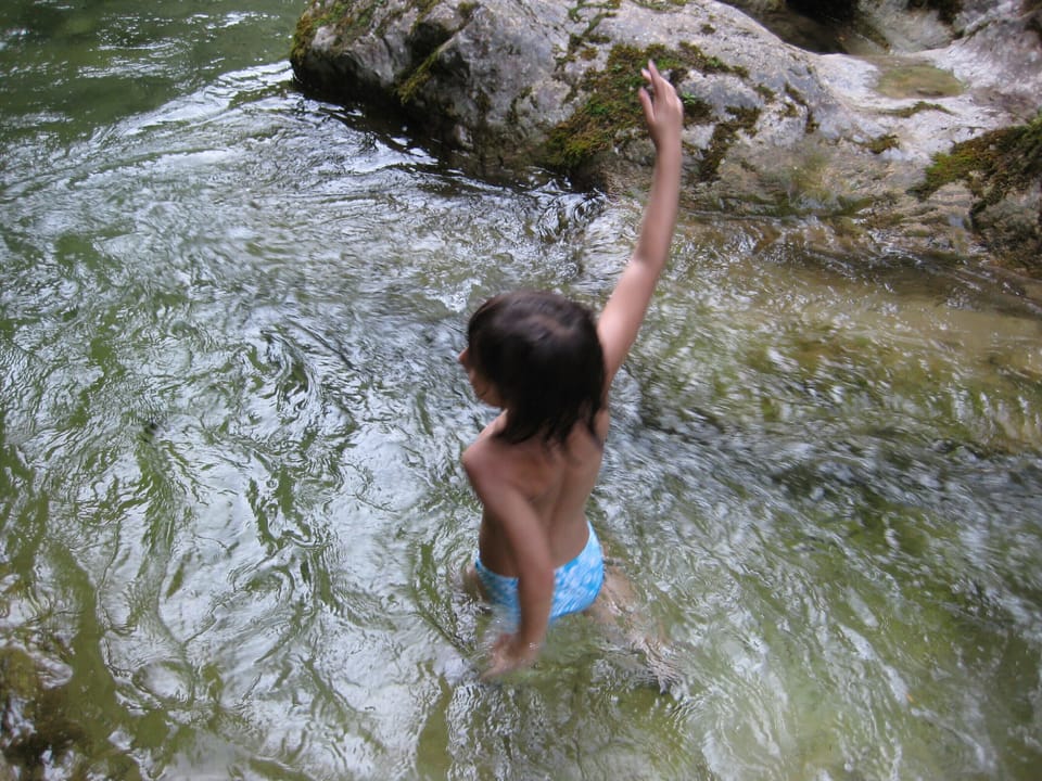 Children adore natural pools in the river Iška