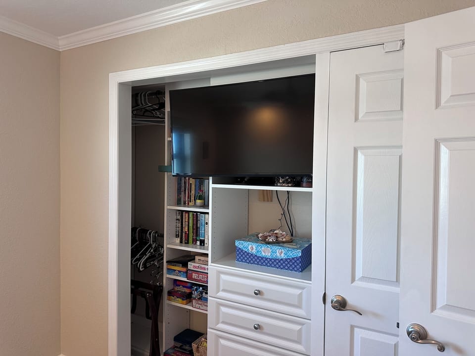 Second bedroom flatscreen TV and California closet