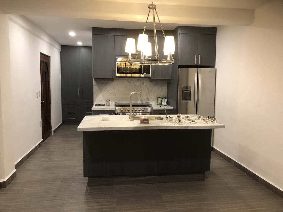 Brand new modern open concept kitchen with filtered water.