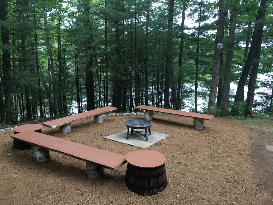 Campfire area overlooking lake.