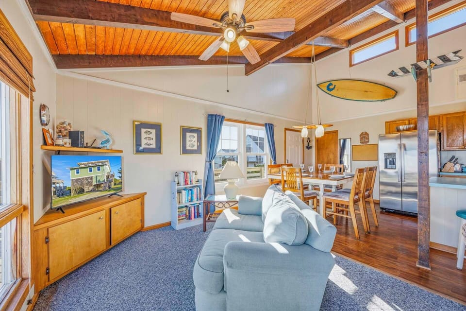Relax in your bright, open living space with exposed beams, modern amenities, and coastal charm throughout.