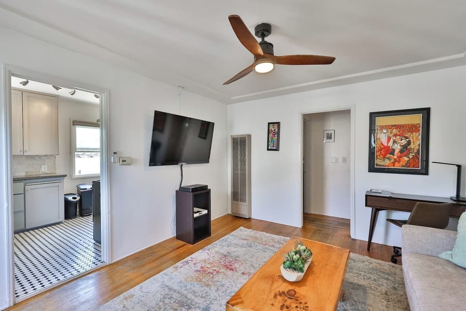Smart TV has Netflix, DirecTV, Amazon Prime. The living room is bathed in natural light, thanks to large windows that offer scenic views of the surrounding area. If you prefer a bit more privacy or want to control the amount of sunlight, simply draw 