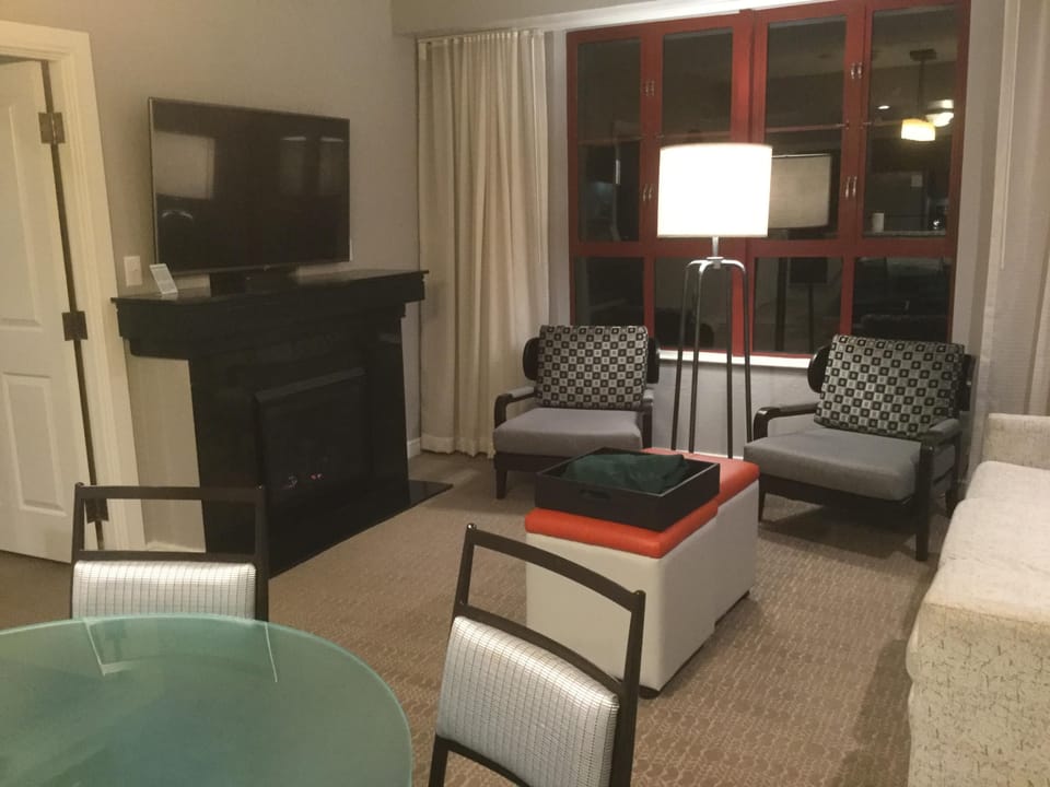 Living room with fireplace and 50 "TV and pullout couch.