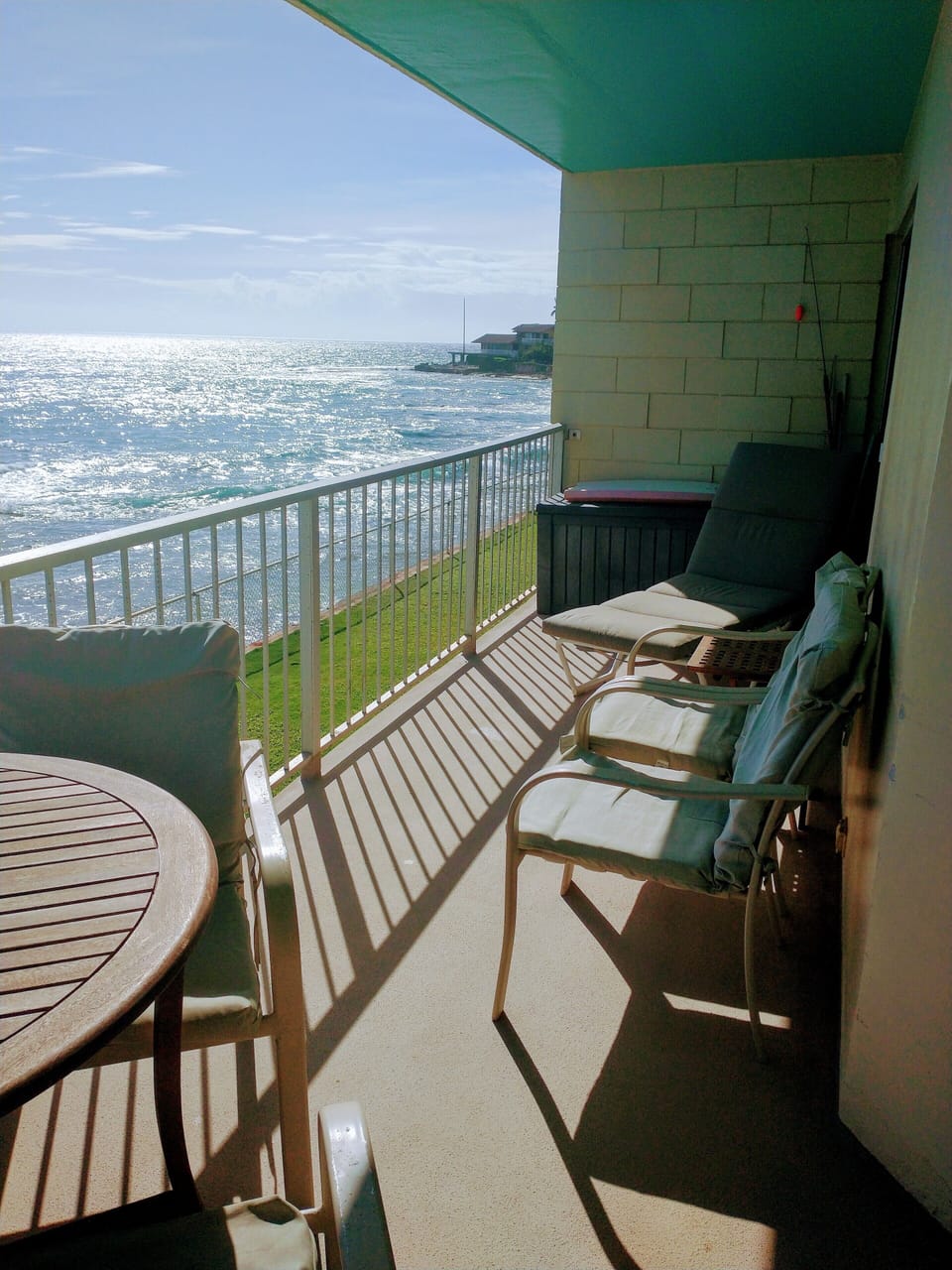 Relax. 2 lounge chairs on the lanai along with dinning table and 4 chairs.