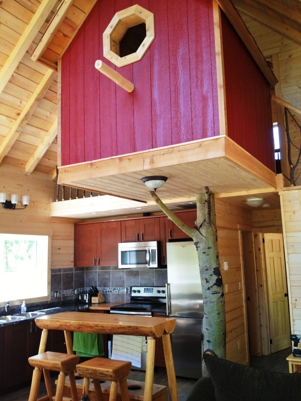 The birdhouse is a neat sleeping area. It has two small twins that fits adults.