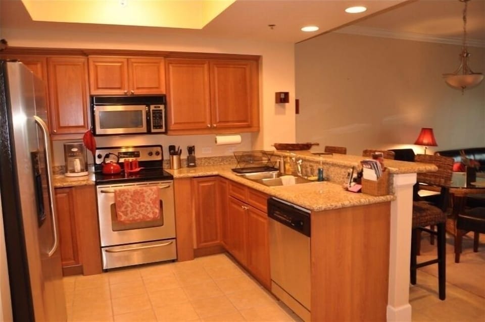 Luxury kitchen with granite countertop and stainless steel appliances
